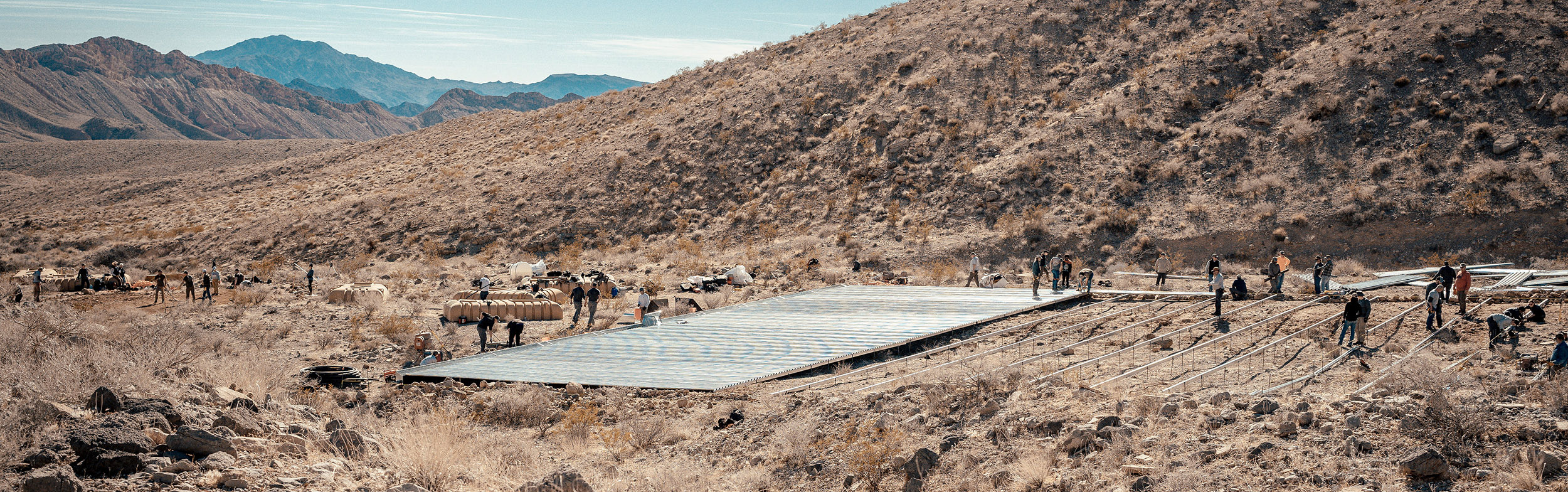 Volunteers building a water guzzler in the Muddy Mountains for wildlife